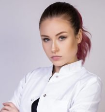 stable girl in white doctor uniform